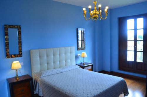 Katil atau katil-katil dalam bilik di apartamentos y habitaciones Quinta La Espadaña apartamentos y habitaciones Quinta la Espadaña