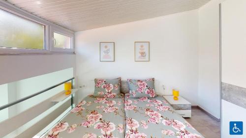 a small bedroom with a bed and a window at Apartments Mare in Pula