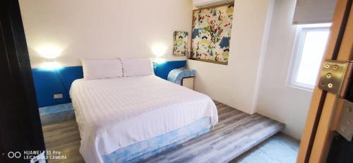 Postel nebo postele na pokoji v ubytování Nandu Inn