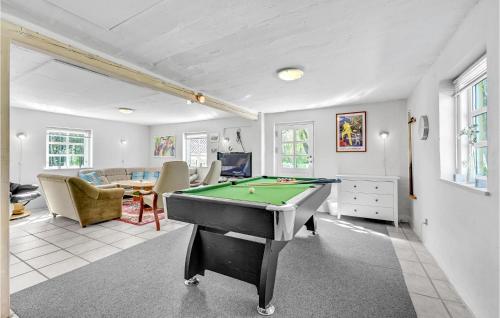 a living room with a pool table in it at Pet Friendly Apartment In Strynø in Rudkøbing