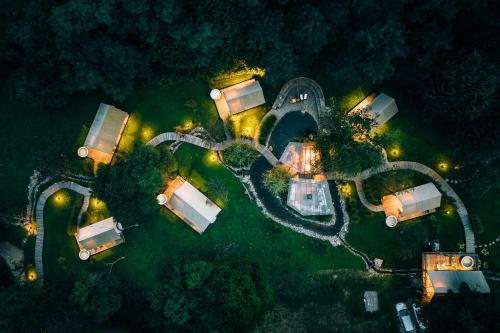 an overhead view of a house at night with lights at Luxury vineyard resort Chateau Ramšak in Maribor