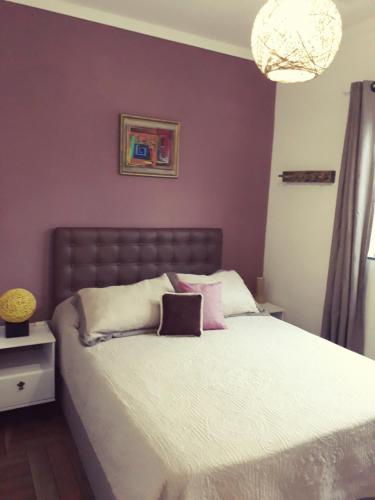 Ένα ή περισσότερα κρεβάτια σε δωμάτιο στο Apartamento Praia do Santinho nº103