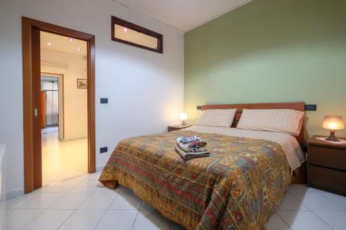 a bedroom with a bed and two night stands with lamps at Salvanna Centro Storico in Naples