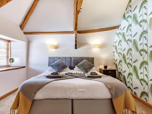 a bedroom with a large bed in a room at Old Rydon Inn in Kingsteignton