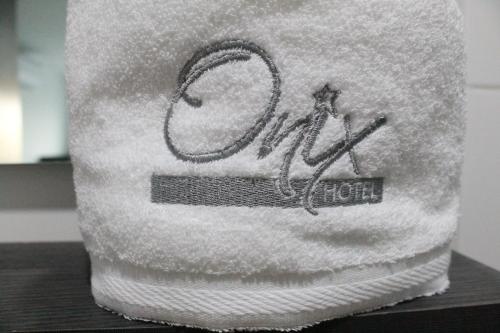 a towel with the word snow written on it at Onix Hotel in Neiva