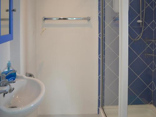 a bathroom with a sink and a shower at Rivendell - Ukc2323 in St Ives
