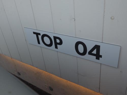 a sign on a wall that reads top four at Ahorn 4 in Gröbming