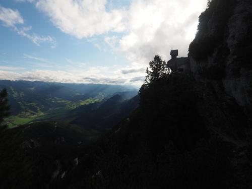 a house on the side of a mountain overlooking a valley at Ahorn 4 in Gröbming
