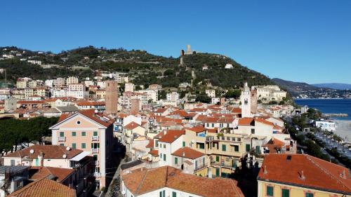 a view of a city with buildings and the ocean at Noliday Riviera Sea View Luxury Apartment in Noli
