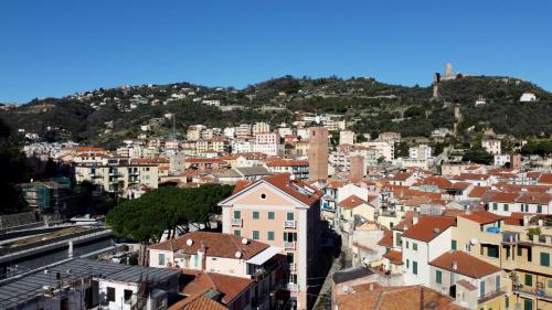 a view of a city with houses and a mountain at Noliday Riviera Sea View Luxury Apartment in Noli