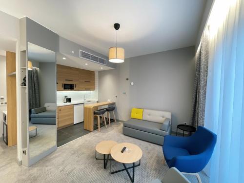 a living room with a couch and a table at Holiday Inn Express - Ankara - Airport by IHG in Ankara