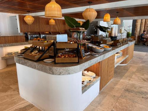a bakery with a counter with food on it at Punta Sal Suites & Bungalows Resort in Canoas De Punta Sal