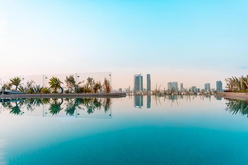 a view of the city from a swimming pool at Andaz Condesa Mexico City, By Hyatt in Mexico City