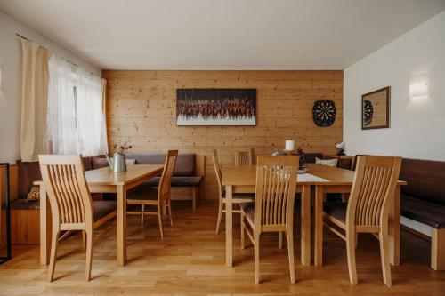 a dining room with a table and chairs at Bauernhof Unterbichl in Flachau