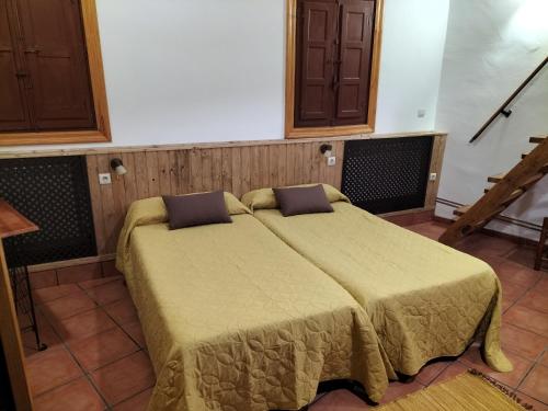 a bedroom with a large bed in a room at Don Camino in Villalcázar de Sirga