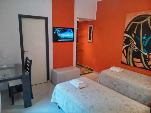 Łóżko lub łóżka w pokoju w obiekcie Hotel Pucará