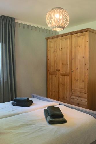 Postel nebo postele na pokoji v ubytování Moderne Wohnung im skandinavischen Stil am Waldrand