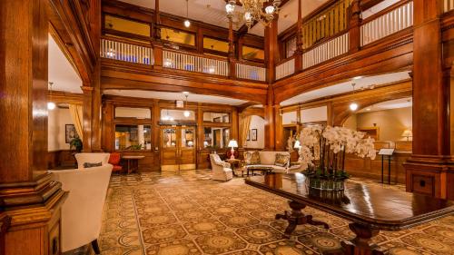 a large room with a table and chairs at Windsor Hotel, an Ascend Collection Hotel in Americus