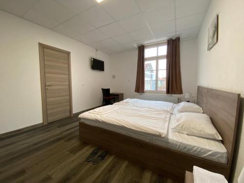 Ένα ή περισσότερα κρεβάτια σε δωμάτιο στο Hotel da Luca