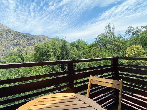 a wooden bench sitting on top of a balcony at La Petite France in San José de Maipo