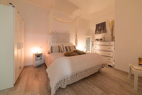 A bed or beds in a room at IL NIDO DEL FASO