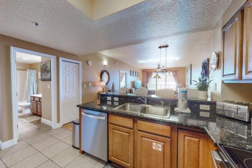 a kitchen with a sink and a dishwasher at Ariel Dunes I 1709 in Destin