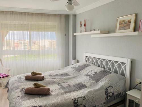 Voodi või voodid majutusasutuse Apartment with a view of the sea toas