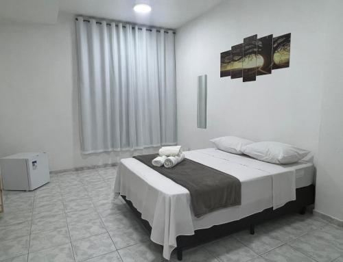 Ένα ή περισσότερα κρεβάτια σε δωμάτιο στο Pousada Styllus da Serra