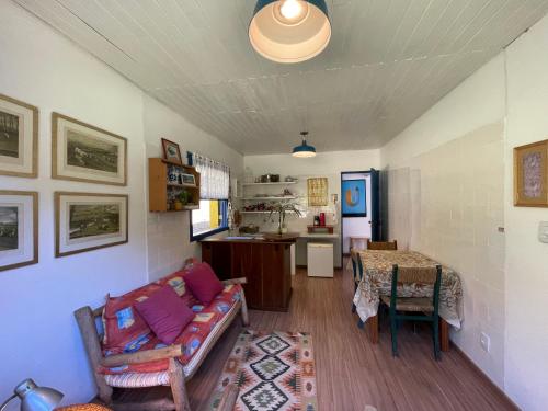 a living room with a couch and a table at Hospedaria Fazenda São João do Vale da Grama in Visconde De Maua