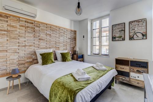 En eller flere senge i et værelse på Espaces 55, Maison de ville au centre de Lavaur