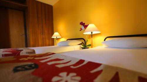 Postel nebo postele na pokoji v ubytování Mansoori Apart Hotel II