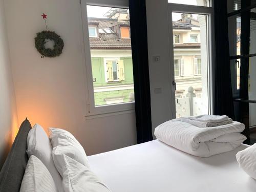 Posteľ alebo postele v izbe v ubytovaní L'ECLECTIQUE Bolzano