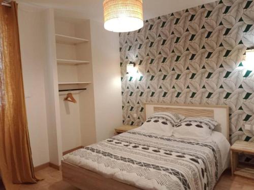 Krevet ili kreveti u jedinici u okviru objekta Gonnelles Appartement T3 Centre Ville RDC D