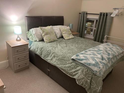 Ein Bett oder Betten in einem Zimmer der Unterkunft The Unicorn Hotel