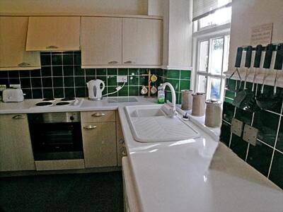 a kitchen with a white sink and a window at Baycliff Apartment in Lindale