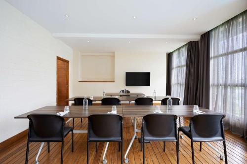 a conference room with a large table and chairs at Radisson Hotel Tamboho Waterfront Antananarivo in Antananarivo