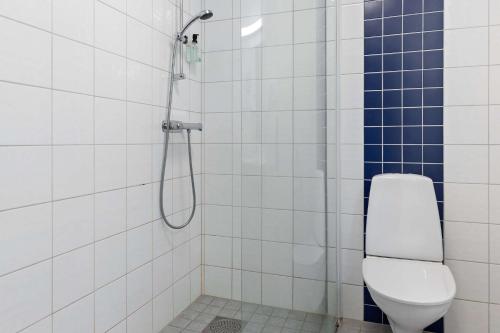 a bathroom with a toilet and a shower at Sure Hotel by Best Western City Jonkoping in Jönköping