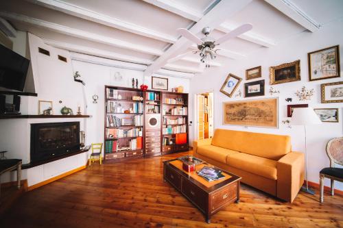 a living room with a couch and a fireplace at DUOMO - The Warm Maison - EXCLUSIVE in Milan