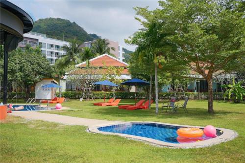 a swimming pool with a toy in a park at Kata Forte Resort in Kata Beach