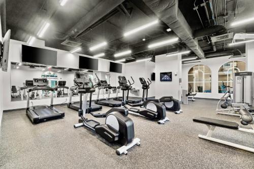 a gym with several treadmills and cardio machines at Luxury Calypso Tower 3! Free Beach Chair Service for 4! by Dolce Vita Getaways PCB in Panama City Beach