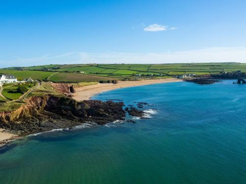 an aerial view of a beach and the ocean at Savernake in Thurlestone