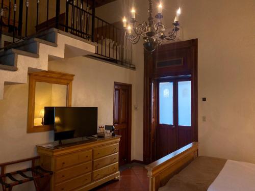 Estrella de Belem B&B and Spaにあるテレビまたはエンターテインメントセンター