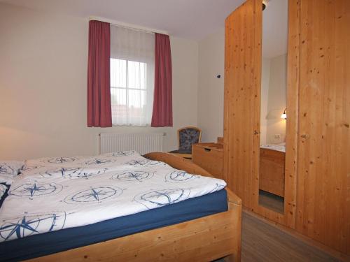 מיטה או מיטות בחדר ב-Resort Orther Reede, Fehmarn-Orth