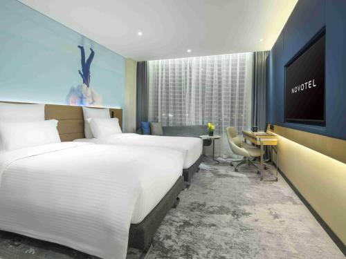 Телевизор и/или развлекательный центр в Novotel Guangzhou Baiyun Airport - Canton Fair Free Shuttle Bus & Official Registration Agency