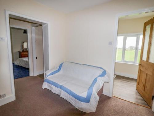 a bedroom with a bed in a room with a window at The Manor House at Kenwick Lodge in Ellesmere