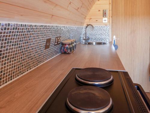 a kitchen with a stove with a counter top at Pabbay - Uk40612 in Trumisgarry