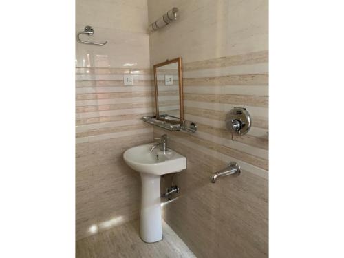 Ein Badezimmer in der Unterkunft Hotel Ramanam