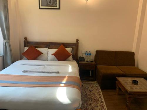 Ein Bett oder Betten in einem Zimmer der Unterkunft Hotel Ramanam