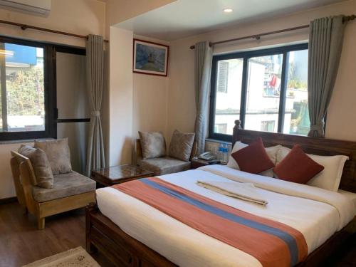 Ein Bett oder Betten in einem Zimmer der Unterkunft Hotel Ramanam