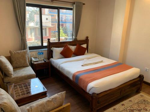 Postel nebo postele na pokoji v ubytování Hotel Ramanam